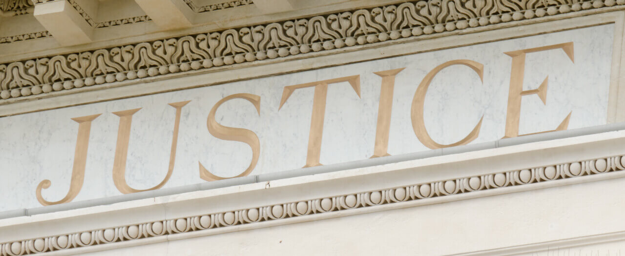 Justice, carved in building facade